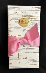 Medium Sampler in a pink chevron gift wrapped box with a white ribbon